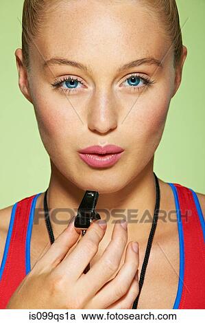 Sportswoman with whistle View Large Photo Image Stock Image - Sportswoman with whistle. Fotosearch