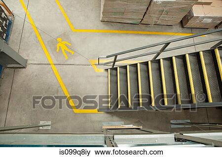 Stock Photo - Steps and yellow lines in warehouse, elevated view. Fotosearch