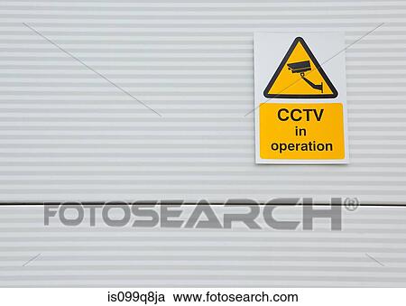 Surveillance camera sign on warehouse door View Large Photo Image Stock Image - Surveillance camera sign on warehouse door. Fotosearch
