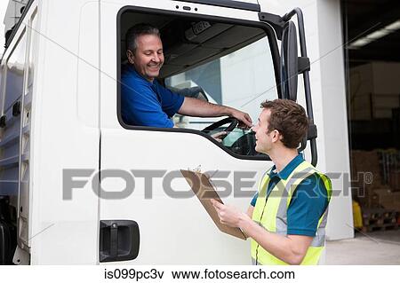 Stock Photo - Truck driver and man with clipboard. Fotosearch