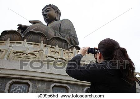 Woman taking photograph of tian tan buddha, hong kong, china View Large Photo Image Stock Image - Woman taking photograph of tian tan buddha, hong kong, china. Fotosearch