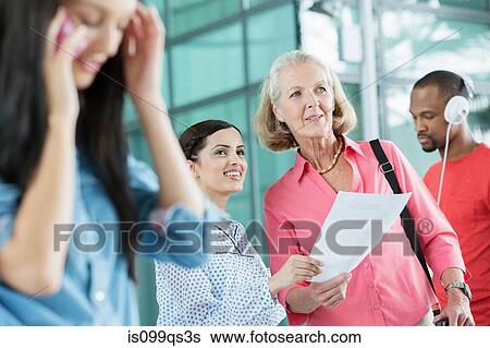 Women in an airport View Large Photo Image Stock Photograph - Women in an airport. Fotosearch
