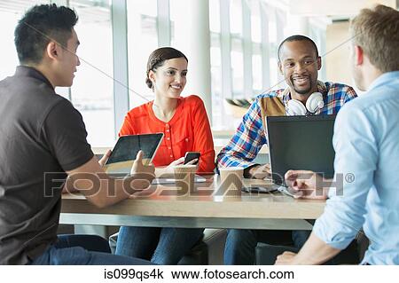 Young business people in meeting View Large Photo Image Stock Image - Young business people in meeting. Fotosearch