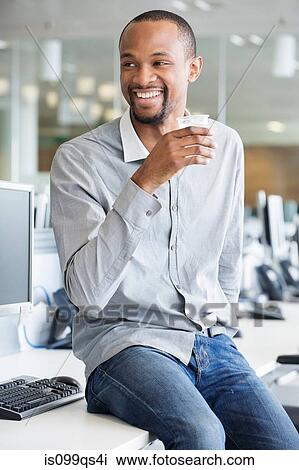 Young businessman in office View Large Photo Image Stock Image - Young businessman in office. Fotosearch