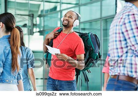 Young man in airport View Large Photo Image Stock Photo - Young man in airport. Fotosearch