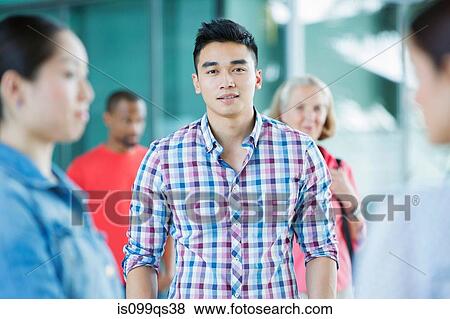 Young man in crowd View Large Photo Image Stock Photo - Young man in crowd. Fotosearch