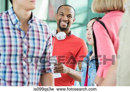 Young man in crowd View Large Photo Image Stock Photo - Young man in crowd. Fotosearch