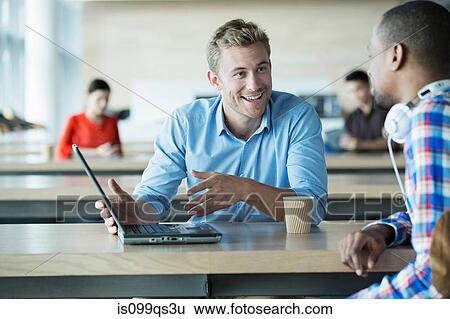 Young men discussing idea View Large Photo Image Stock Photograph - Young men discussing idea. Fotosearch