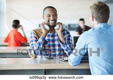 Young men in break room View Large Photo Image Stock Photo - Young men in break room. Fotosearch