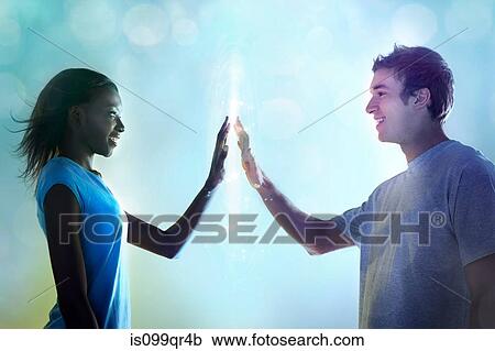Young people touching light View Large Photo Image Stock Image - Young people touching light. Fotosearch
