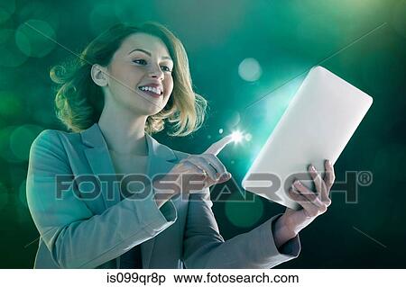 Young woman digital tablet and light on finger View Large Photo Image Stock Photography - Young woman digital tablet and light on finger. Fotosearch
