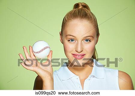 Young woman holding baseball View Large Photo Image Stock Image - Young woman holding baseball. Fotosearch