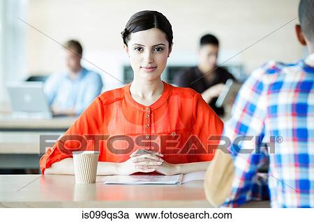 Young woman in break room View Large Photo Image Stock Image - Young woman in break room. Fotosearch