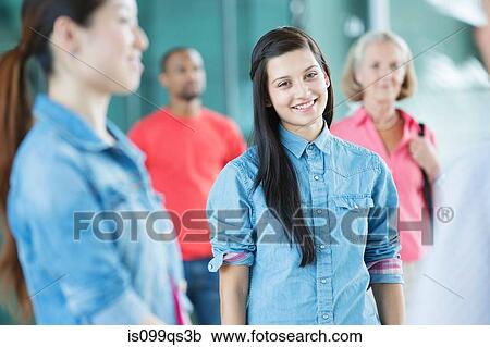 Young woman in crowd View Large Photo Image Stock Image - Young woman in crowd. Fotosearch