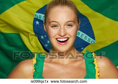 Young woman in front of Brazilian flag View Large Photo Image Stock Photo - Young woman in front of Brazilian flag. Fotosearch