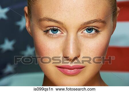 Picture - Young woman in front of USA flag. Fotosearch