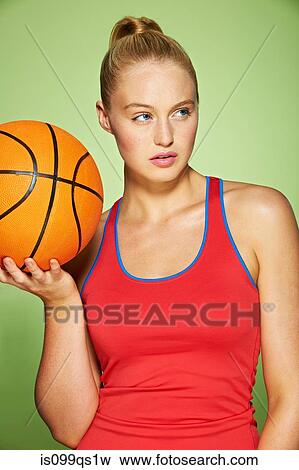 Young woman with basketball View Large Photo Image Stock Photo - Young woman with basketball. Fotosearch
