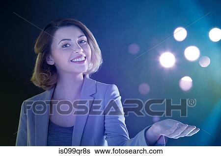 Young woman with lights View Large Photo Image Stock Photograph - Young woman with lights. Fotosearch