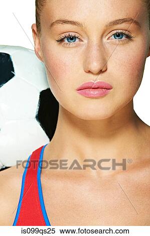 Stock Photography - Young woman with soccer ball. Fotosearch