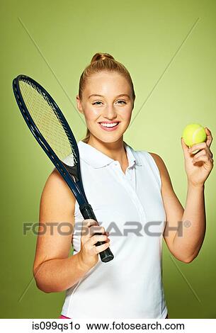 Picture - Young woman with tennis racket and tennis ball. Fotosearch