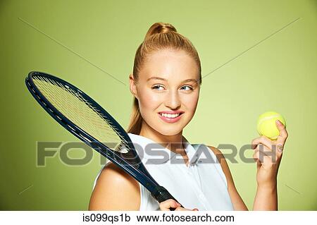 Young woman with tennis racket and tennis ball View Large Photo Image Stock Image - Young woman with tennis racket and tennis ball. Fotosearch