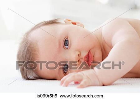 Stock Photography - Baby girl, lying on side. Fotosearch