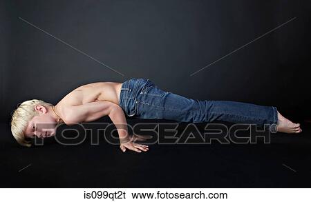 Boy doing push up View Large Photo Image Stock Photograph - Boy doing push up. Fotosearch