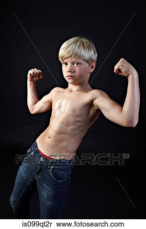 Boy flexing muscles View Large Photo Image Stock Photography - Boy flexing muscles. Fotosearch