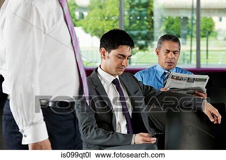 Businessman texting on smartphone View Large Photo Image Stock Image - Businessman texting on smartphone. Fotosearch