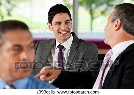 Businessmen having conversation View Large Photo Image Stock Image - Businessmen having conversation. Fotosearch