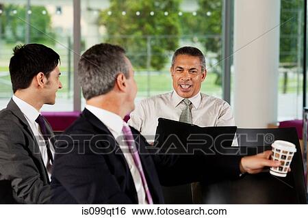 Businessmen having conversation View Large Photo Image Stock Photograph - Businessmen having conversation. Fotosearch