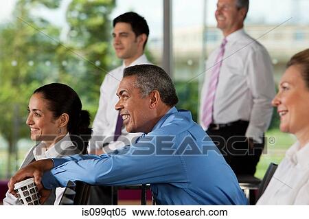 Businesspeople at presentation View Large Photo Image Stock Photography - Businesspeople at presentation. Fotosearch
