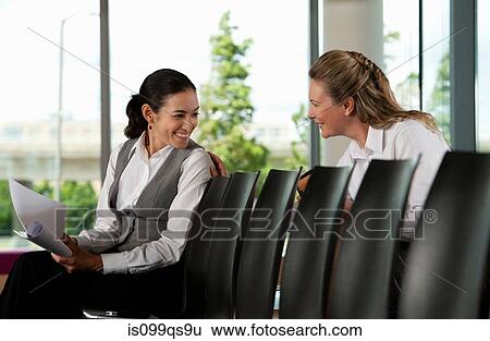 Businesswomen having conversation View Large Photo Image Stock Photograph - Businesswomen having conversation. Fotosearch