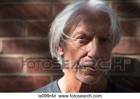 Close of portrait of a mature man View Large Photo Image Stock Photograph - Close of portrait of a mature man. Fotosearch