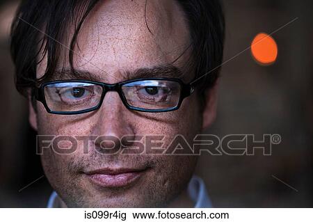 Close up on face of a man wearing glasses View Large Photo Image Stock Image - Close up on face of a man wearing glasses. Fotosearch