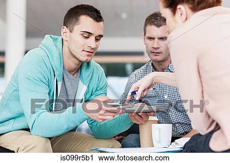 Colleagues in creative meeting View Large Photo Image Stock Image - Colleagues in creative meeting. Fotosearch