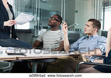 Colleagues planning during creative meeting View Large Photo Image Stock Image - Colleagues planning during creative meeting. Fotosearch