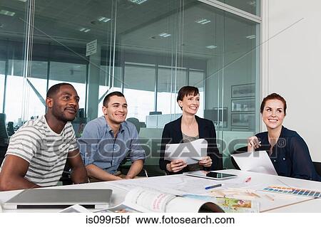 Colleagues planning during creative meeting View Large Photo Image Stock Image - Colleagues planning during creative meeting. Fotosearch