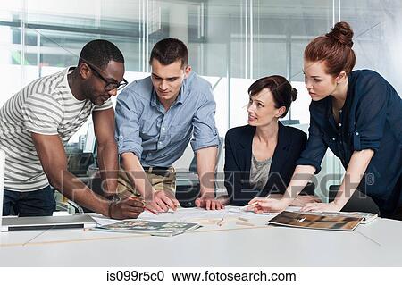 Colleagues planning during creative meeting View Large Photo Image Stock Image - Colleagues planning during creative meeting. Fotosearch