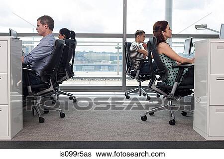 Creative business people at workstations View Large Photo Image Stock Photograph - Creative business people at workstations. Fotosearch