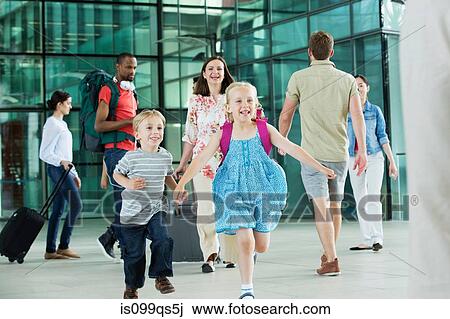 Excited children running on airport concourse View Large Photo Image Stock Image - Excited children running on airport concourse. Fotosearch