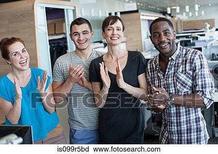 Four people clapping in office interior View Large Photo Image Stock Image - Four people clapping in office interior. Fotosearch