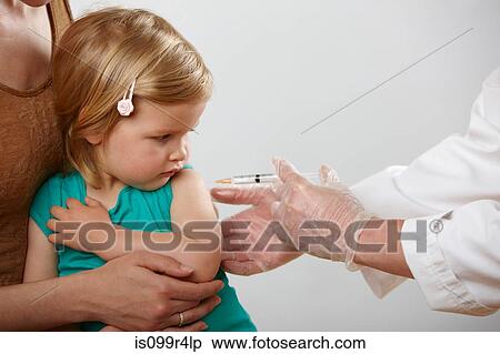 Stock Photography - Little girl having an injection. Fotosearch