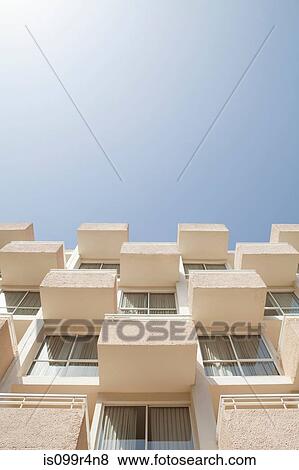 Stock Photo - Low angle view of holiday apartments. Fotosearch