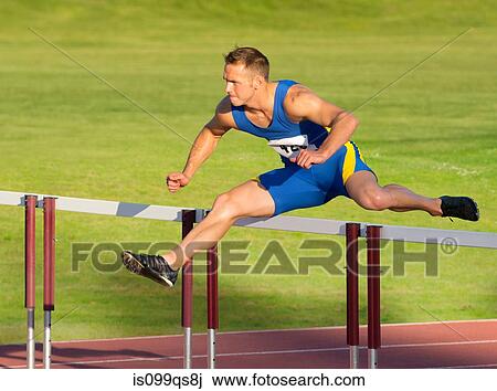 Male hurdler clearing hurdle View Large Photo Image Stock Image - Male hurdler clearing hurdle. Fotosearch