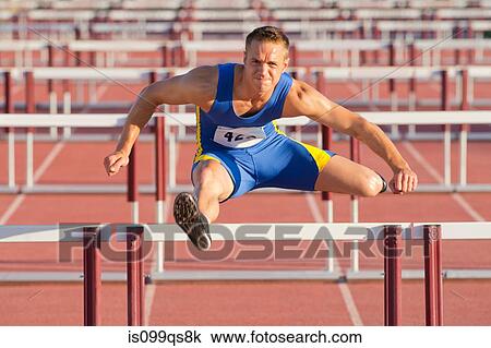 Male hurdler clearing hurdles View Large Photo Image Stock Image - Male hurdler clearing hurdles. Fotosearch