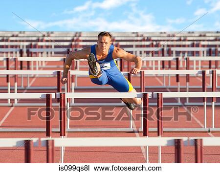 Male hurdler clearing hurdles View Large Photo Image Stock Image - Male hurdler clearing hurdles. Fotosearch
