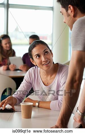 Man and woman having conversation in cafe View Large Photo Image Stock Image - Man and woman having conversation in cafe. Fotosearch