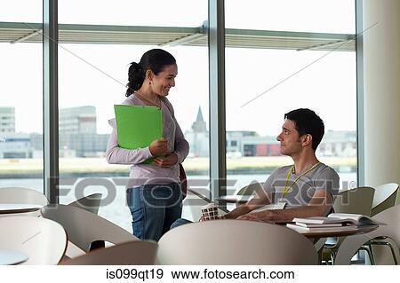 Man and woman having conversation in cafe View Large Photo Image Stock Photo - Man and woman having conversation in cafe. Fotosearch