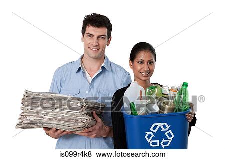 Man and woman holding recycling bin with bottles and newspapers View Large Photo Image Stock Photo - Man and woman holding recycling bin with bottles and newspapers. Fotosearch